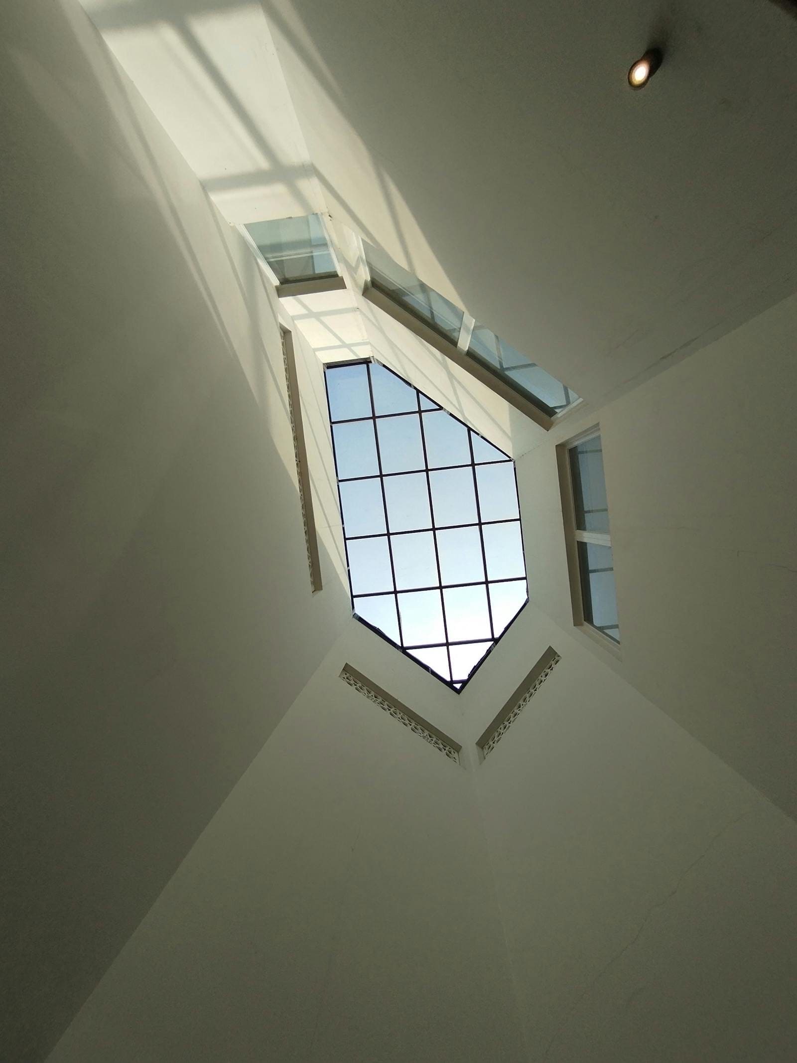Architectural sky window — Atrium · pitched glazing
